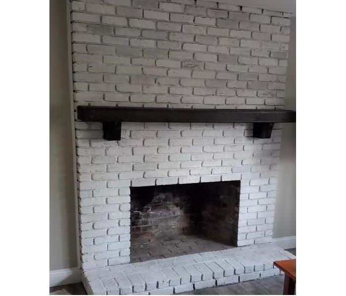 fire place after with a fresh coat of white paint
