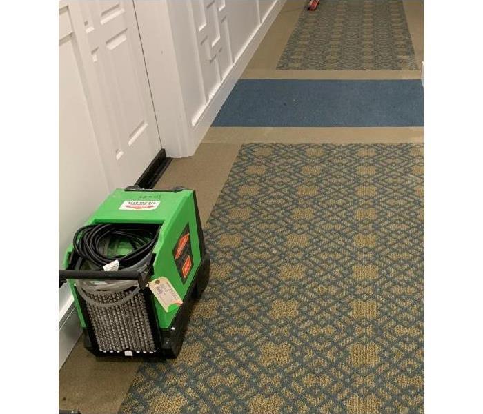 Water damage in hallway of large complex